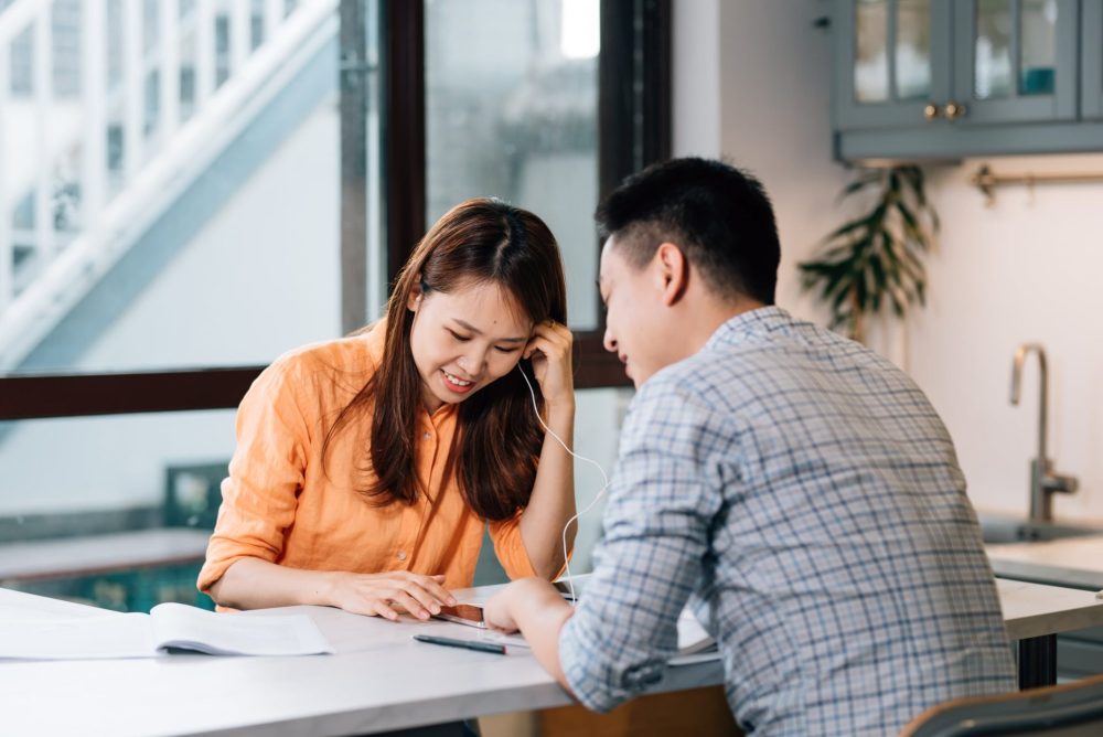 Two colleagues working at a table