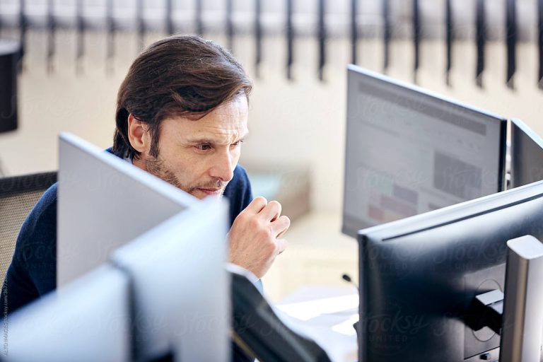 analyst working at his desk