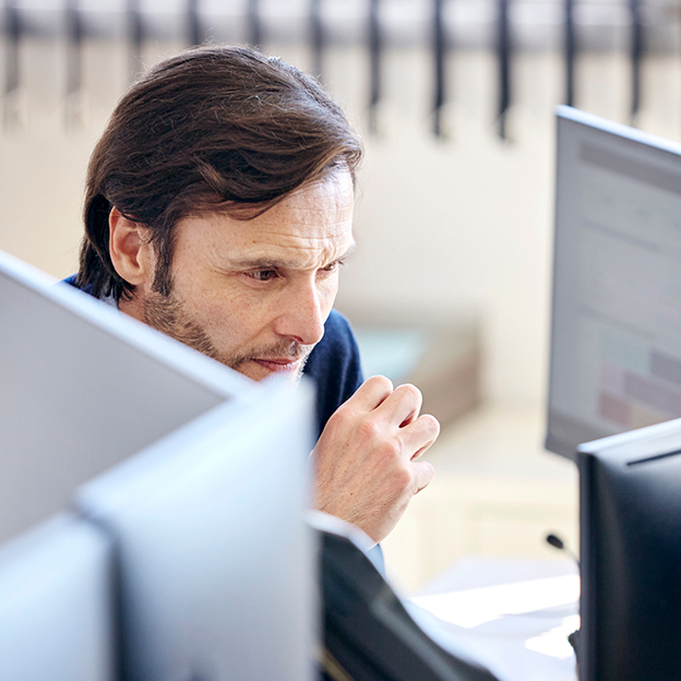 Analyst working on his computer.
