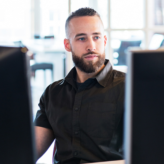 Young analyst on a computer